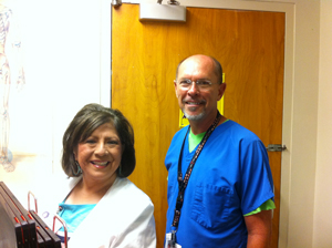 This is a picture of two FCHD employees working in the Radiology department.